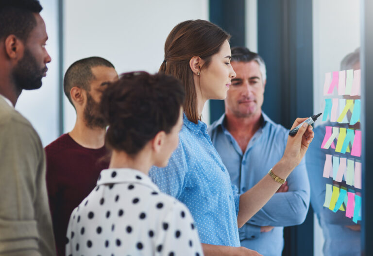 its a step by step guide. cropped shot of a group of businesspeo